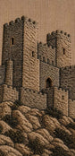 A close-up of a stitched or embroidered stone castle scene in warm brown and beige tones, with textured fabric visible across the entire frame.

