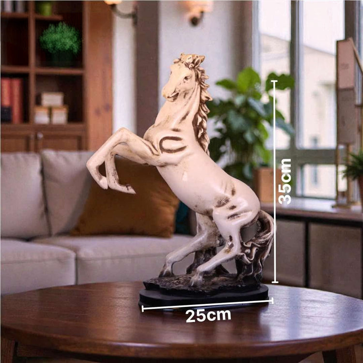 A rearing horse statue displayed on a round wooden table in a living room setting, with overlaid dimension lines showing 35 cm height and 25 cm base width.

